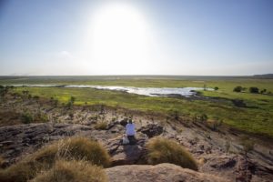 Kakadu - lady watching the sunset over Ubirr - Luxury Private Air Tour
