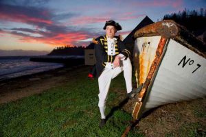 Norfolk Island - captain standing beside shipwreck - luxury short breaks